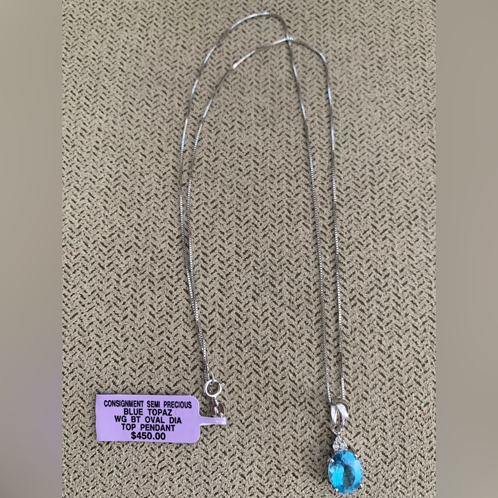 Blue Topaz Oval Pendant With Diamonds Set In 14k White Gold